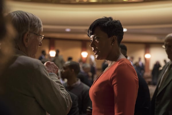 Atlanta Mayoral candidate Keisha Lance Bottoms, center, talks with people following a political forum moderated by former Atlanta City Council President Cathy Woolard at the Carter Center, Tuesday, Nov. 28, 2017. ALYSSA POINTER/ALYSSA.POINTER@AJC.COM