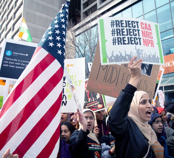 Marchers proceed along Centennial Olympic Park Drive near CNN Center during the Americans United for Justice in India rally  on Sunday, January 26, 2020.  STEVE SCHAEFER / SPECIAL TO THE AJC