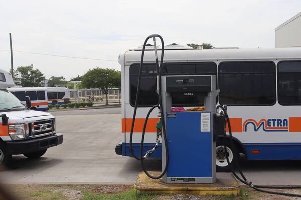 A line of METRA buses prepping to add diesel fuel to their bus near the Transfer Center. (Photo Courtesy of Kala Hunter)