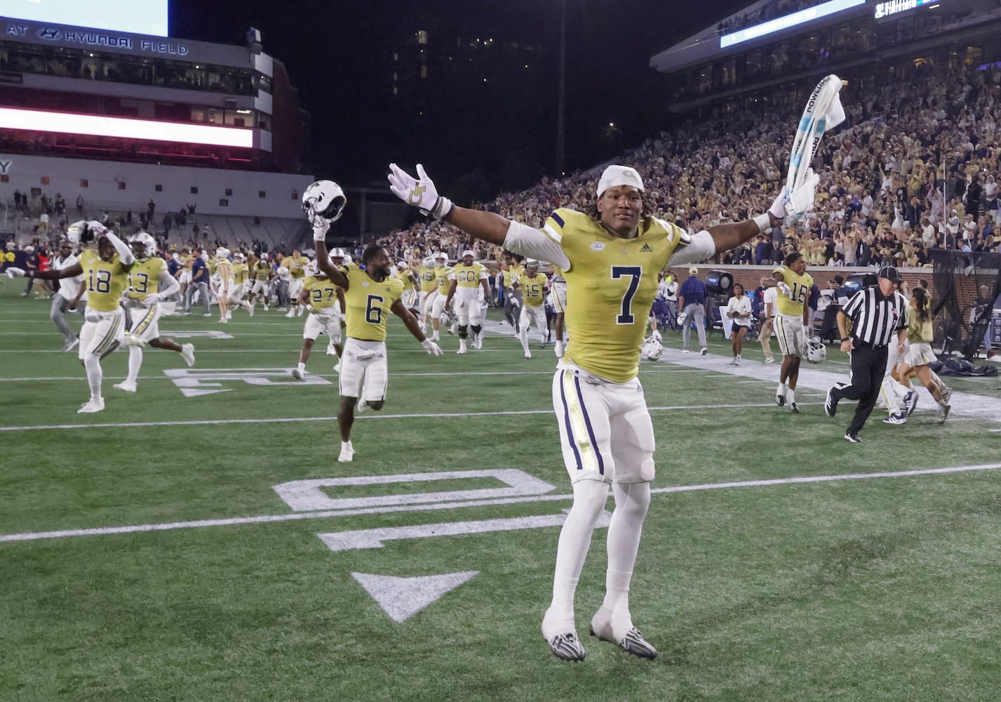 Georgia Tech players celebrate as time runs out in a 46-42 win over North Carolina on Saturday, Oct. 28, 2023.  (Bob Andres for the Atlanta Journal Constitution)