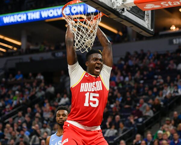 Clint Capela yells after dunking the ball against the Minnesota Timberwolves during the second half of an NBA basketball game Friday, Jan. 24, 2020, in Minneapolis. (AP Photo/Craig Lassig)