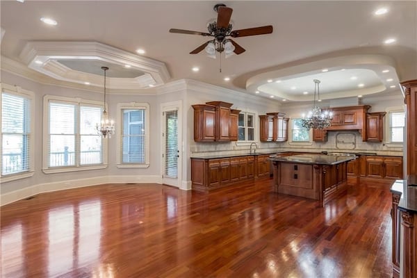 The kitchen features a large island and breakfast nook. 