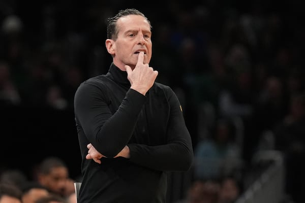 Cleveland Cavaliers head coach Kenny Atkinson watches his players during the first half of an NBA basketball game against the Boston Celtics, Friday, Feb. 28, 2025, in Boston. (AP Photo/Charles Krupa)