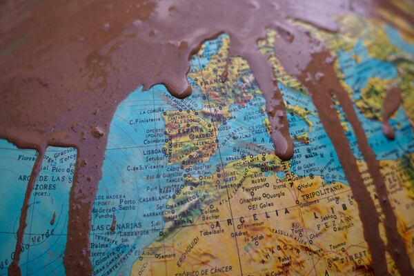 Part of a rotating World Globe Map showing Spain is covered in mud after floods in Paiporta, near Valencia, Spain, Monday, Nov. 4, 2024. (AP Photo/Alberto Saiz)