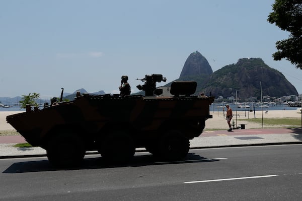 An Army armored car patrols along Copacabana beach during the G20 Summit in Rio de Janeiro, Tuesday, Nov. 19, 2024. (AP Photo/Bruna Prado)