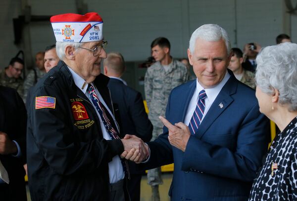 Vice President Mike Pence spent a moment talking with WWII Navy veteran Alan Hall, from Canton, and his wife, Buena, at Dobbins Air Reserve Base after speaking there Friday.