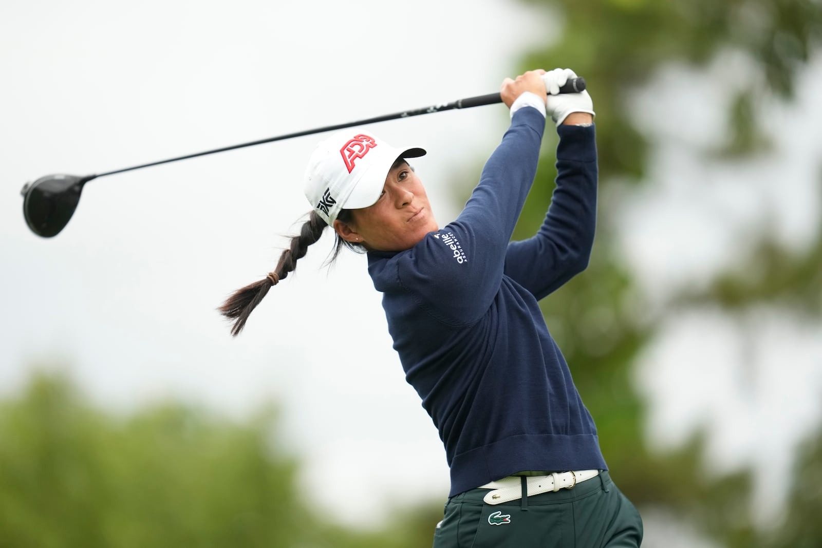 Celine Boutier of France watches her tee shot on the sixth hole during the third round of the LPGA Ladies Championship golf tournament at the Seowon Valley Country Club in Paju, South Korea, Saturday, Oct. 19, 2024. (AP Photo/Lee Jin-man)