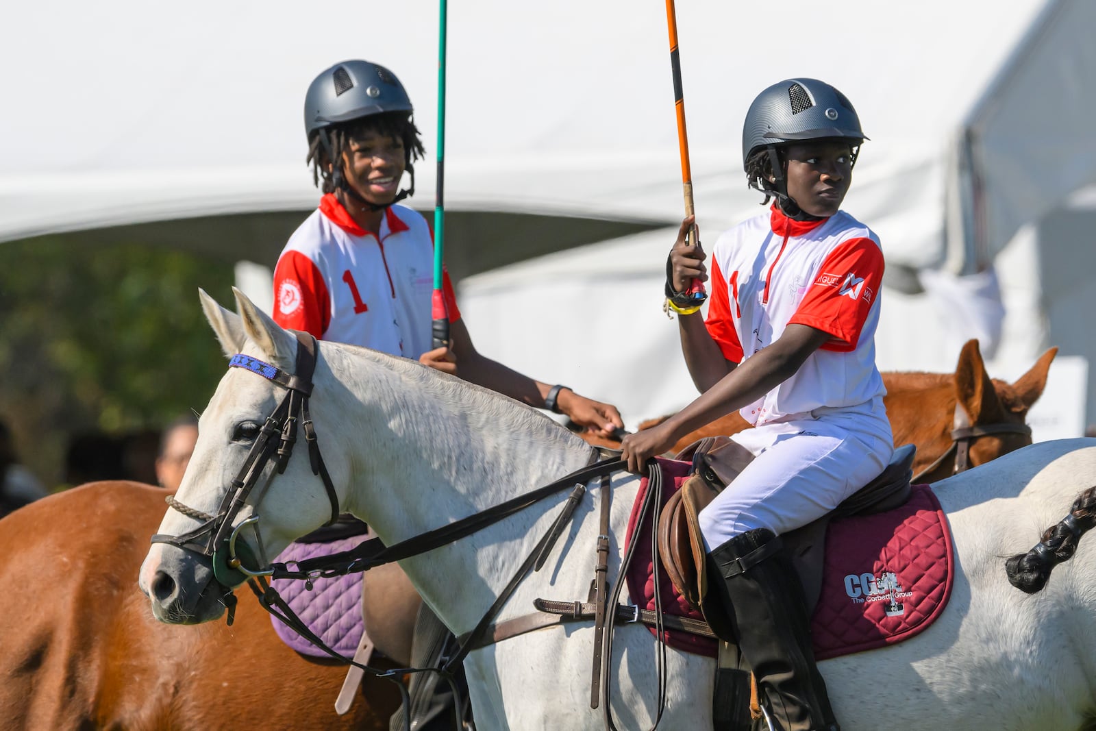 B.E.S.T. Academy polo players warm up with their horses during the 7th Annual Atlanta Fashion and Polo Classic on Sunday, Oct. 13, 2024, in Fairburn, GA. (Jim Blackburn for the AJC)