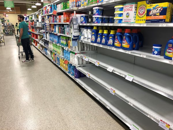 Shortages of particular items have hit grocery store shelves as people have engaged in some hoarding and panic-induced buying because of the spread of COVID-19. In this Publix in Cobb County, all the bleach, which can be used for sanitizing, has been purchased, though the shelves remain full of other clothes cleaning products.