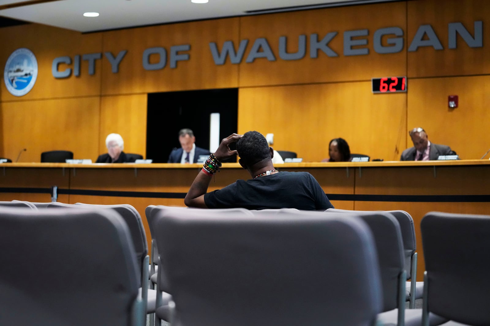 Clyde McLemore, executive director for Black Lives Matter Lake County, listens as he attends the city council meeting in Waukegan, Ill., Monday, Sept. 16, 2024. (AP Photo/Nam Y. Huh)