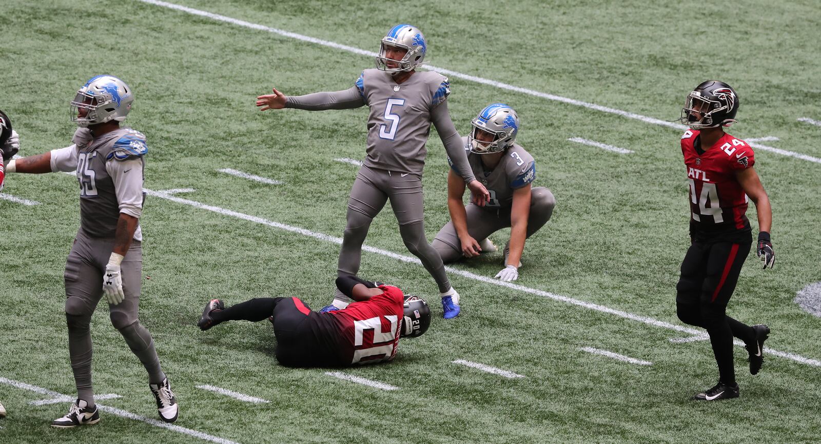 Falcons cornerbacks Kendall Sheffield (20) and A.J. Terrell (24) are unable to block the attempt by Detroit Lions kicker Matt Prater (5), who watches his extra-point try sail through uprights, to beat the Falcons 23-22 Sunday, Oct. 25, 2020, at Mercedes-Benz Stadium in Atlanta. (Curtis Compton / Curtis.Compton@ajc.com)