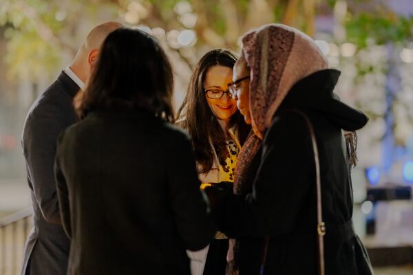 Janet Smith, a Sparta resident and leader of the No Railroad in Our Community Coalition, leads a candlelight vigil and prayer along with attorneys for the Institute for Justice at Woodruff Park on Monday, November 27, 2023.  (Jason Allen for the Atlanta Journal Constitution)