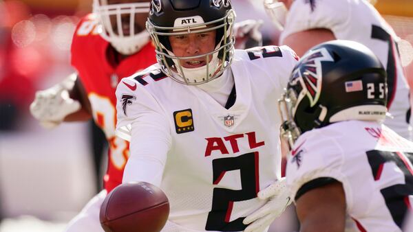 Atlanta Falcons quarterback Matt Ryan hands off to running back Ito Smith during the first quarter against the Kansas City Chiefs, Sunday, Dec. 27, 2020, in Kansas City, Mo. (Charlie Riedel/AP)