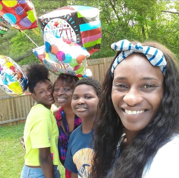 Deshon DuBose (center) with his sister Maya DuBose (from left), grandmother Vanessa Rodgers and mother Charlett DuBose. 