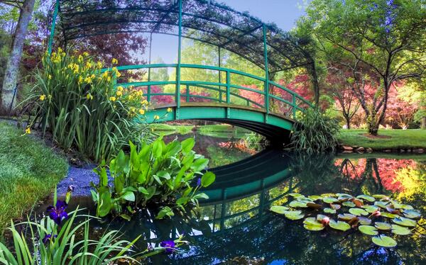 This bridge at Gibbs Gardens is a replica of a bridge that Claude Monet built over a lily pond on his property in Giverny, France, and subsequently painted more than a dozen times. Photo: Gibbs Gardens