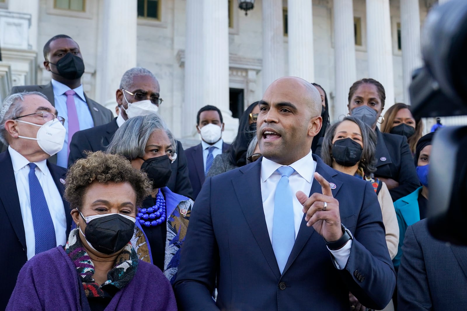 FILE - Rep. Colin Allred, D-Texas, right, standing next to Rep. Barbara Lee, D-Calif., front left, speaks to reporters outside on Capitol Hill in Washington, Tuesday, Feb. 8, 2022. (AP Photo/Susan Walsh, File)