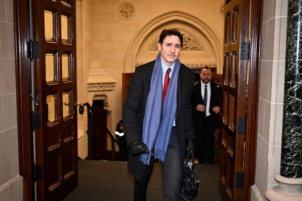 Canada's Prime Minister Justin Trudeau arrives to address media following the imposition of a raft of tariffs by U.S. President Donald Trump against Canada, Mexico and China, in Ottawa, Saturday, Feb. 1, 2025. (Justin Tang/The Canadian Press via AP)