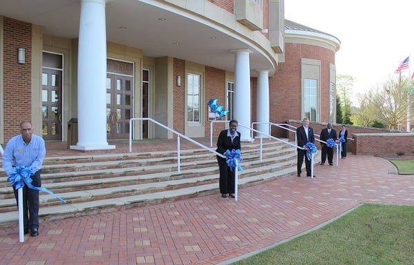 In 2015, Stockbridge’s then-mayor and council members tied blue bows at City Hall for the “Paint Henry Blue” campaign for child abuse prevention. Each year, Stockbridge joins other cities around the nation in supporting the Prevent Child Abuse America organization. (PHOTO HANDOUT / April 2015)