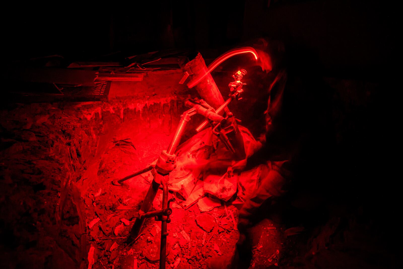 A Ukrainian serviceman of the Bugskiy Gard unit aims a 120mm mortar before firing towards Russian positions on the front line, in the Kherson region, Ukraine, Sunday, Nov. 3, 2024. (AP Photo/Marko Ivkov)