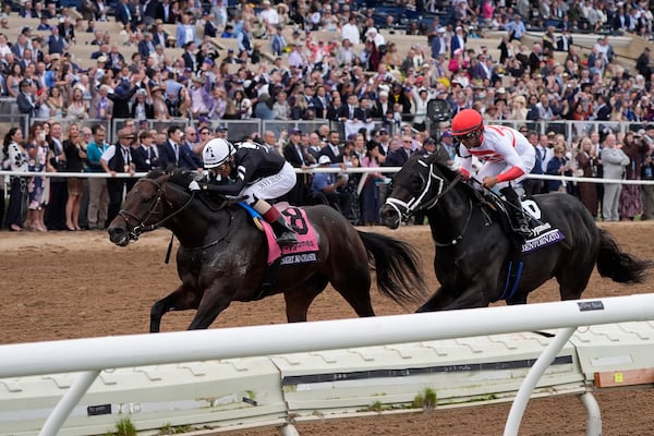 John Velazquez rides Straight No Chaser, left, to victory past Luis Saez, riding Bentornato, in the Breeders' Cup Sprint horse race in Del Mar, Calif., Saturday, Nov. 2, 2024. (AP Photo/Gregory Bull)