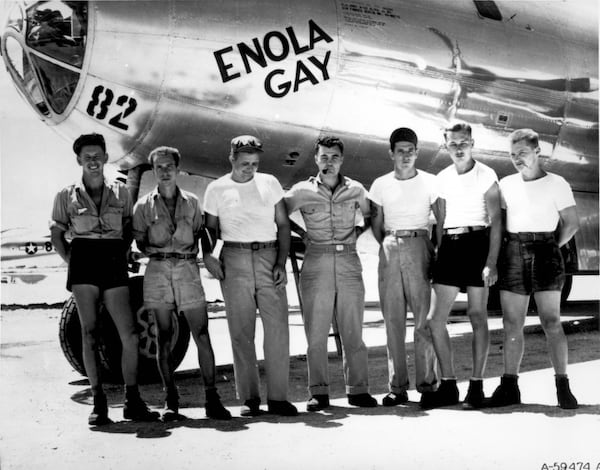 The U.S. ground crew of the Enola Gay, led by pilot Paul W. Tibbets (center), made history by dropping an atomic bomb on the Japanese city of Hiroshima on Aug. 6, 1945.