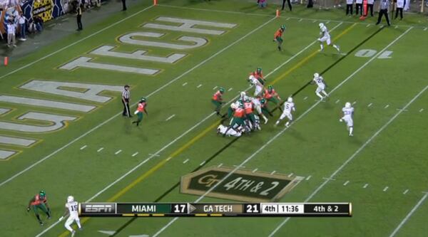 Thomas has pulled the ball from the mesh as Laskey dives into the line. Perhaps most critically, Laskey has the attention of end Anthony Chickillo (straddling the line of scrimmage) and Bush (at the 6-yard line on the right hashmark). “The guy who lost the ball was the defensive end,” Johnson said. The ends had been going wide on triple-option plays and had been the pitch key for Thomas (how the end defended the option determined whether Thomas would keep or pitch).