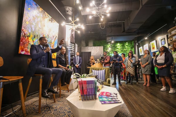 Atlanta Mayor Andre Dickens, left, talks with Lakeysha “Key” Hallmon, founder of The Village Market ATL, during the Village Retail Black Biz Celebration and Fireside Chat at The Village Retail at Ponce City Market, Monday, Feb. 27, 2023, in Atlanta. Jason Getz / Jason.Getz@ajc.com)
