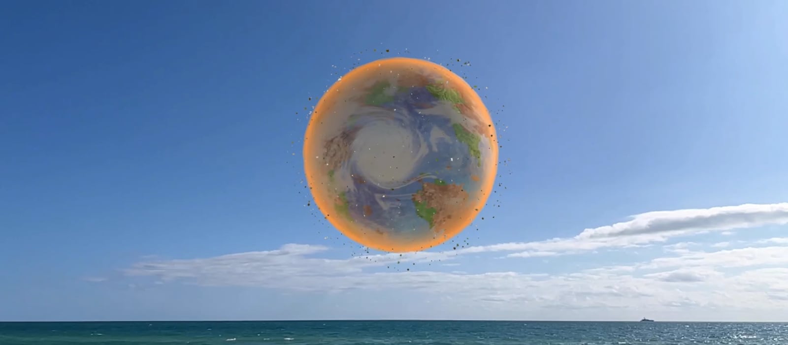 Nancy Baker Cahill created a version of “Stone Speaks” in Miami; this image shows the augmented reality sphere floating above the ocean.