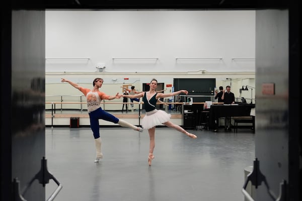 Unity Phelan, center, and Joseph Gordon, left, rehearse for New York City Ballet's "Swan Lake," Tuesday, Feb. 25, 2025, in New York. (AP Photo/Julia Demaree Nikhinson)