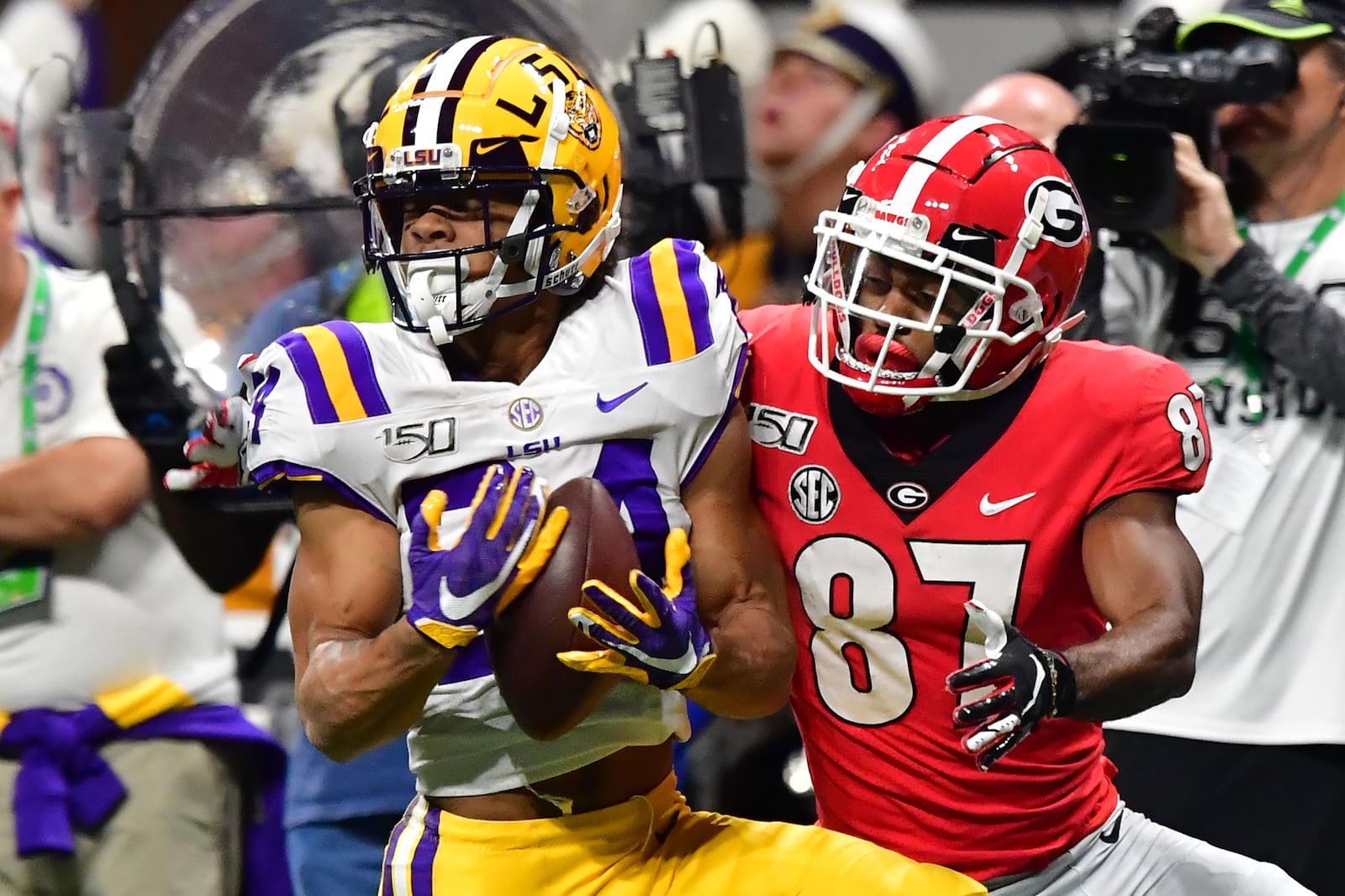 12/7/19 - Atlanta -  LSU's Derek Stingley Jr. (24) catches a throw in front of Georgia Bulldogs wide receiver Tyler Simmons (87) during the first half of the Georgia vs. LSU SEC Football Championship game at Mercedes-Benz Stadium in Atlanta.  Hyosub Shin / hyosub.shin@ajc.com