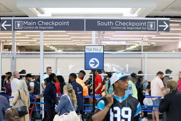 Passengers move through TSA security lines at the Hartsfield-Jackson Atlanta International Airport on Monday, May 22, 2023. The airport’s current forecast shows it could handle 2.1 million passengers from Thursday, May 25, through Wednesday, May 31. 
Miguel Martinez /miguel.martinezjimenez@ajc.com