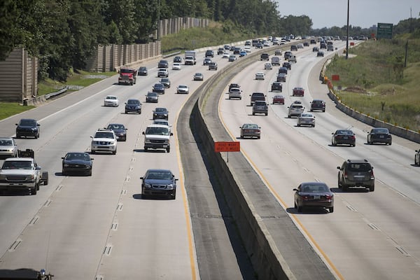 Automobiles travel along Georgia 400, Wednesday, July 24, 2019. Cities along Ga. 400 are talking about petitioning the Georgia Department of Transporation to have a say in how the new highway is being designed as part of the ongoing widening project. (Alyssa Pointer/alyssa.pointer@ajc.com)