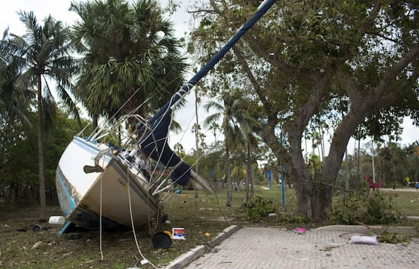 A boat was swept up from the water onto land in Coconut Grove, Fla., a neighborhood in Miami, after Hurricane Irma passed through the area on September 11, 2017. 