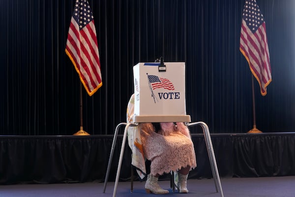 A voter works on her ballot at a polling place at the Ronald Reagan Presidential Library on Election Day, Tuesday, Nov. 5, 2024, in Simi Valley, Calif. (AP Photo/Chris Pizzello)