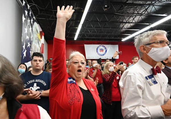 Supporters react as U.S. Sen. Kelly Loeffler (not pictured) speaks during a rally Wednesday at Cobb County GOP headquarters to unite Georgia conservatives behind her and U.S. Sen. David Perdue ahead of the Jan. 5 runoffs. Some Republicans have expressed concern that the refusal by President Donald Trump and other party officials to recognize Trump's defeat in this month's election will prevent GOP voters from focusing on the Senate runoffs. (Hyosub Shin / Hyosub.Shin@ajc.com)