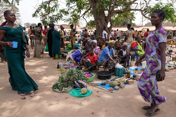 Women sell their goods at Nzara open market near Nzara, South Sudan on Saturday, Feb. 15, 2025. (AP Photo/Brian Inganga)