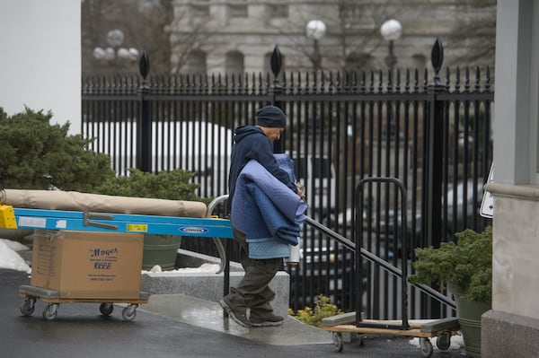 Movers load trucks at the White House grounds two days before Inauguration Day and a new administration, in Washington, Saturday, Jan. 18, 2025. (AP Photo/Rod Lamkey, Jr.)