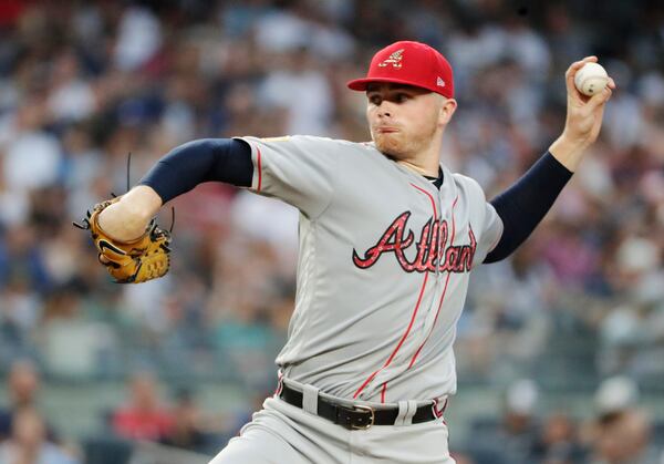 Braves pitcher Sean Newcomb delivers a pitch in the first inning on a steamy Tuesday night at Yankee Stadium. He lasted a career-low 2 2/3 innings and gave up five runs, five walks and two homers. (AP Photo/Frank Franklin II)