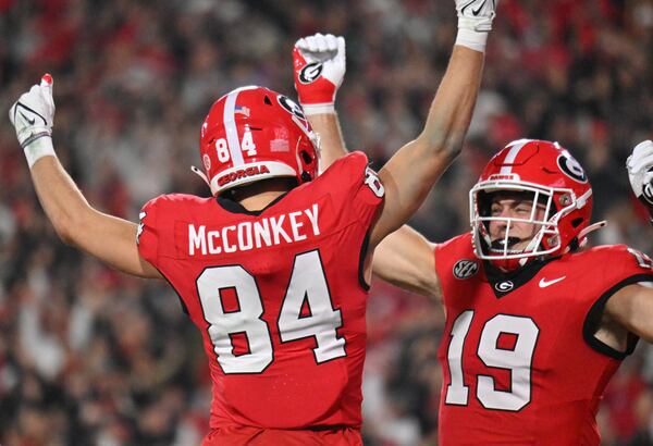 Georgia wide receiver Ladd McConkey (84) celebrates with Georgia tight end Brock Bowers (19). (Hyosub Shin / Hyosub.Shin@ajc.com)