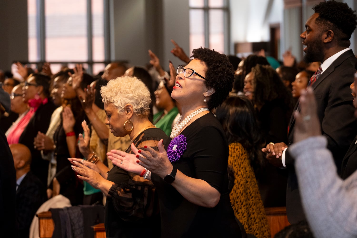 The audience reacts during a musical performance at the Dr. Martin Luther King Jr. Day program at Ebenezer Baptist Church in Atlanta on Monday, Jan. 15, 2024.  (Ben Gray / Ben@BenGray.com)