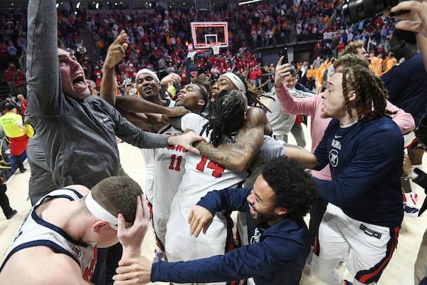 Mississippi players celebrate a win over Tennessee following an NCAA college basketball game in Oxford, Miss., Wednesday, Mar. 5, 2025. (AP Photo/Bruce Newman)