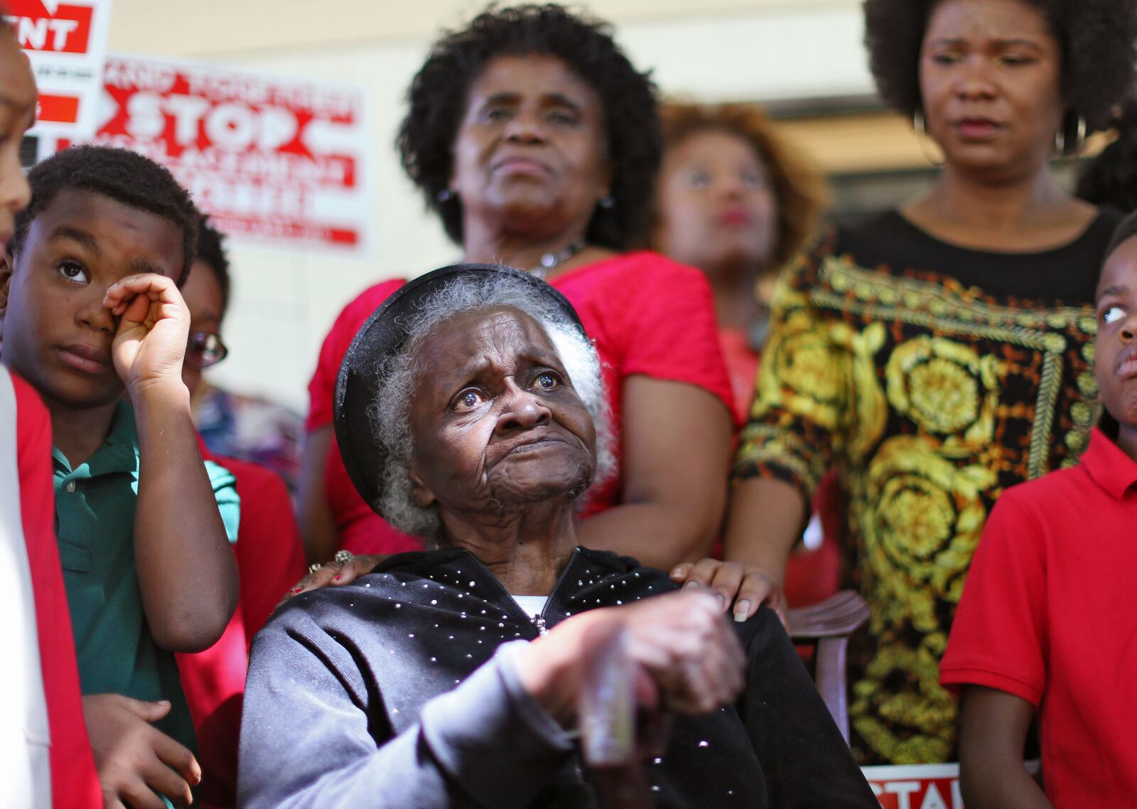 Sep. 15, 2015 - Atlanta - 93 year old Mattie Jackson (left), who said she plans to stand her ground, is comforted by Tanya Washington (right). Tanya Washington, a law professor who lives on Atlanta Ave, hosted Peoplestown residents who have decided not to leave their homes for a rally and press conference. 93 year old Mattie Jackson and the remaining residents on her block held the press conference to declare that they will refuse to leave their homes despite the City’s threat to demolish their homes and build a park and a pond. BOB ANDRES / BANDRES@AJC.COM