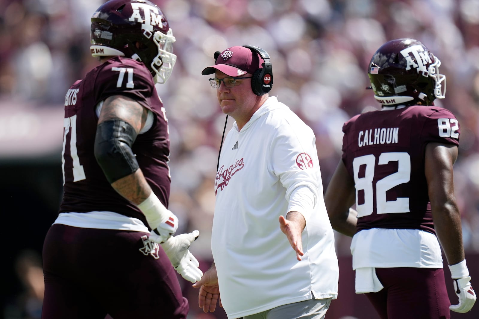 Texas A&M head coach Mike Elko, center, celebrates with players as they walk off the field during the second half of an NCAA college football game against Missouri, Saturday, Oct. 5, 2024, in College Station, Texas. (AP Photo/Eric Gay)