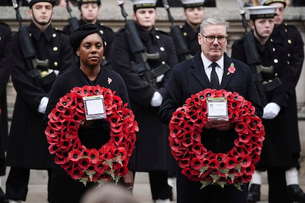 Britain's leader of the opposition Kemi Badenoch, left, and Prime Minister Sir Keir Starmer attend the National Service of Remembrance at The Cenotaph in London, England, Sunday, Nov. 10, 2024. (Aaron Chown/PA via AP)