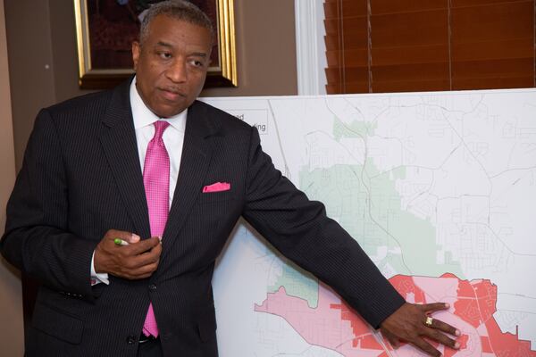 City of Stockbridge City Manager Randy Knighton talks to residents of Moss Pointe Subdivision during a gathering at the home of Regina Lewis-Ward earlier this month about an upcoming ballot measure to make Eagle’s Landing a city. STEVE SCHAEFER / SPECIAL TO THE AJC