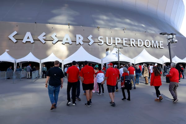 Fans walk through security checkpoints as they enter Caesars Superdome ahead of the Sugar Bowl NCAA College Football Playoff game, Thursday, Jan. 2, 2025, in New Orleans. (AP Photo/Butch Dill)