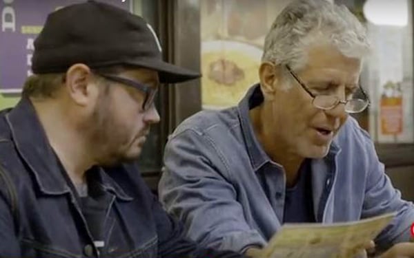 The master instructs the student on the intricacies of Southern cuisine. (Image from CNN video)