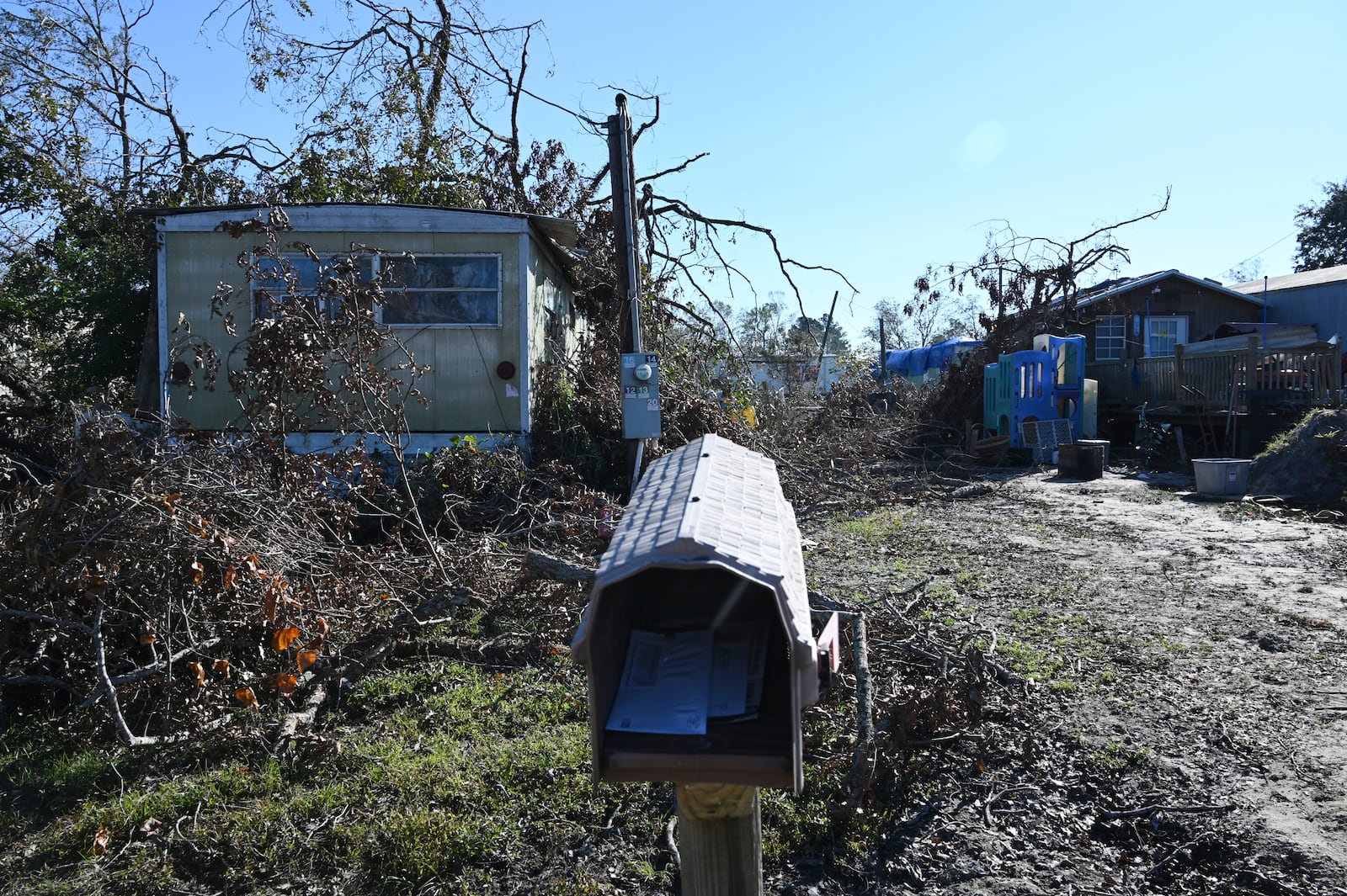 Mail sits inside a mailbox outside a destroyed mobile home in the aftermath of Hurricane Helene at Pecan Park mobile home community on Monday, Oct. 21, 2024, in Hazlehurst, Ga. (Hyosub Shin/AJC)