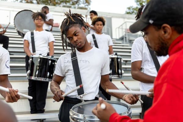 Morris Brown student Elijah Earlington (center), a member of the Clark Atlanta University marching band, practices at Panther Stadium at Clark Atlanta University in Atlanta on Thursday, October 10, 2024. (Arvin Temkar / AJC)