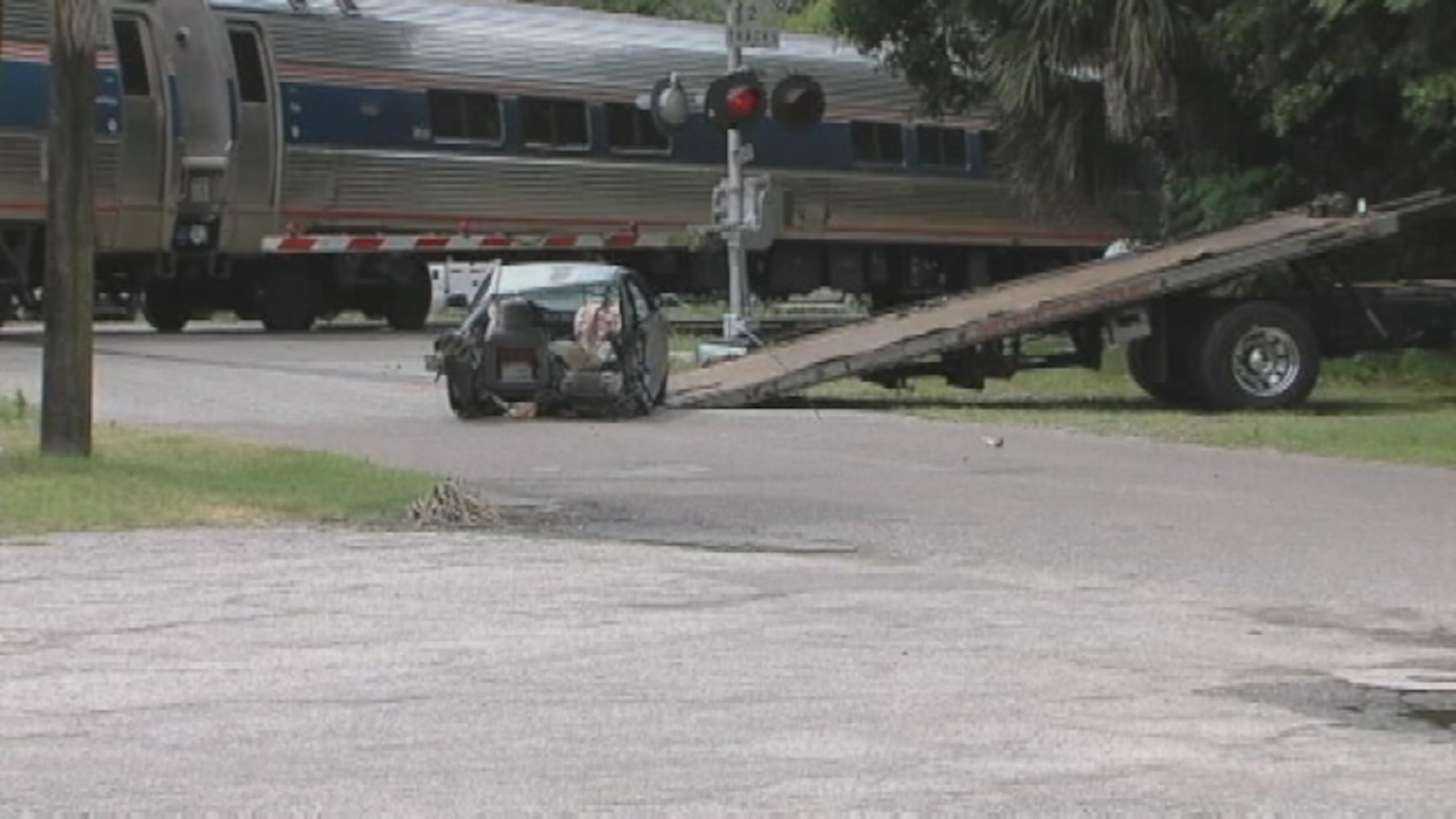 Amtrak train hits car on track